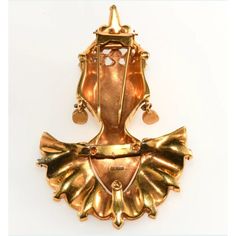 This Reinad Asian Princess fur clip brooch is much more detailed in the design and construction than many others by this company and likely sold at a higher price point when it was new. It has bright, unworn gold plating and rhinestones in two hues of purple along with clear accents. Marked Reinad on the back. Dates to around 1940. Measures about 3 3/4" long and 2 1/2" wide. Condition is excellent with only minor wear to the red paint on the lips. A very dimensional piece of collectible costume jewelry that looks amazing when worn. Gold Art Deco Brooch For Evening, Gold Art Deco Brooches For Evening, Victorian Gold Brooches For Evening, Gold Jeweled Brooches For Formal Occasions, Ornate Gold Brooches For Evening, Formal Gold Jeweled Brooches, Gold Brooches With 17 Jewels For Evening, Elegant Gold Jeweled Brooches, Victorian Jeweled Gold Brooches