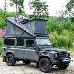 an off - road vehicle is parked in the dirt