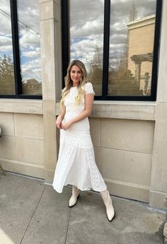 Our Elowen Midi is a mix between boho and chic! She is a white colored lace midi dress with double lining to just the knees! Her fit to flare shape gives the perfect amount of sweetness! Style Recommendations: - Pair with a wedge heel for a beachy, chic outfit! - Add a white heel to dress her up for a bridal shower look! Product Description and Materials: - White lace midi dress - T-shirt style top - Double lined - Fit to flare - Machine wash cold / delicate and line dry Size and Fit: - Model is Midi Dress With Boots, Beachy Chic, Cream Midi Dress, White Lace Midi Dress, Shirt Style Tops, White Heels, Chic Outfit, Lace Midi, Lace Midi Dress