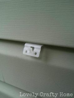 a white door handle on the side of a house