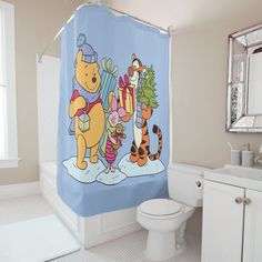 a winnie the pooh shower curtain in a bathroom