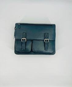 Made from the softest lamb leather, this briefcase is stylish and practical. It features double snap closures in front with decorative buckles. It has a laptop/tablet pocket inside, inner pencil/pen pockets, and additional inner pockets for superior organization. Features an outer back zip pocket and an outer front zip pocket for easy access. It also has a detachable adjustable shoulder strap. Genuine Lamb Leather 12 inches tall x 16 inches wide x 4 inches deep Dye added MSRP: $400.00 Classic Business Laptop Bag With Flap, Classic Business Briefcase With Flap, Leather Flap Briefcase For Work, Soft Leather Flap Satchel For Business, Leather Flap Briefcase For Formal Use, Business Laptop Bag With Flap, Formal Leather Flap Briefcase, Office Satchel With Soft Leather And Flap Shape, Office Flap Satchel In Soft Leather