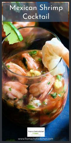 the mexican shrimp cocktail is garnished with cilantro, lime and corn