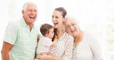 an older man, woman and child are smiling for the camera