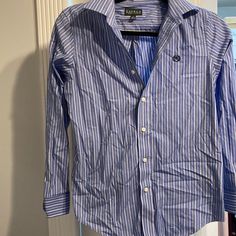 Like New Ralph Lauren Button Down. Beautiful Blue Color With A White Stripe And Embroidered Insignia. Boys Size 14. No Damage, Just Wrinkled From Storage Preppy Blue Top With Buttons, Preppy Blue Shirt With Button Closure, Ralph Lauren Blue Top With Buttons, Preppy Ralph Lauren Button-up Tops, Blue Ralph Lauren Tops With Button Closure, Ralph Lauren Blue Tops With Button Closure, Ralph Lauren Formal Button-up Shirt, Ralph Lauren Plaid Button-up Shirt, Ralph Lauren Shirt