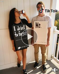 a man and woman standing next to each other holding signs that read i drink hot stuff me