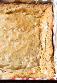 an uncooked pie sitting on top of tin foil