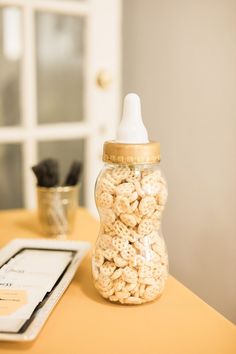 a baby bottle sitting on top of a table