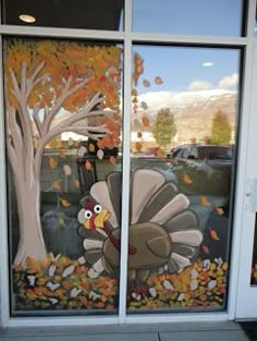 an image of a window with a turkey painted on it