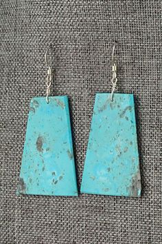 These turquoise and sterling silver earrings were made by Santo Domingo silversmith Lupe Lovato.Height: 2 1/8"Width: 1 1/8"Free shipping on all orders! We ship with USPS and always include tracking. All orders ship within a day of payment.Returns are accepted up to 30 days after you receive your order. Just send us a message. Our shop offers cash back or store credit. The item must be returned in new condition. Artisan Turquoise Sterling Silver Earrings, Artisan Turquoise Pierced Earrings, Sterling Silver Patina Earrings, Unique Turquoise Patina Earrings, Unique Turquoise Earrings With Patina, Spring Sale, Turquoise Sterling Silver, Sterling Silver Earrings, Silver Earrings