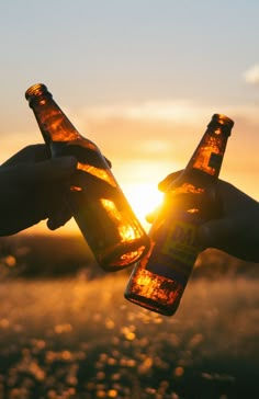 two people toasting beer bottles with the sun setting in the background and text that reads, are you attending athens where to party?