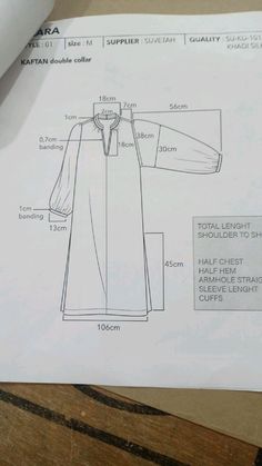 a paper with an image of a long coat on it and instructions for how to sew