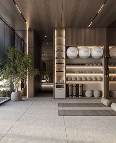 an empty room with many plates and bowls on shelves