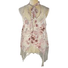 * Petal Ivory * Sheer * Lace * Neck Tie * Sleeveless Materials 100% Polyester Measurements * Size S * Approx: Bust 36" Condition * New Beach Lace Top With Floral Print, Beach Lace Tops With Floral Print, Lace Floral Print Beach Tops, Feminine Cream Tank Top For Spring, White Bohemian Tank Top With Floral Print, Lace Floral Print Tops For Beach, Lace Tops With Floral Print For Beach, Bohemian Lace Top With Floral Print, Beige Lace Blouse For Summer