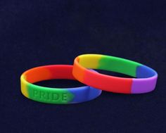 These inexpensive rainbow silicone bracelet wristbands are striped in the colors of the gay pride flag and are made of high quality 100% silicone that you can see and feel. The bracelets are embossed with the word PRIDE and are approximately 8 inches in circumference. Gay Pride Bracelet, Teal Ribbon, Pride Bracelet, Gay Pride Flag, Kids Bracelets, Rainbow Bracelet, Pride Parade, Silicone Bracelets, Fundraising Events