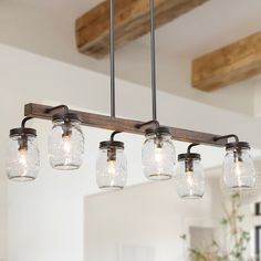 mason jar chandelier with lights hanging from the ceiling