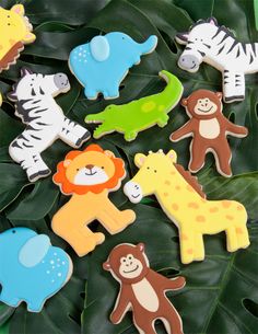 there are many decorated cookies in the shape of animals