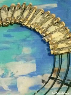 a close up of a metal rack with money on it's sides and blue sky in the background