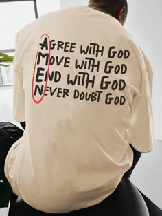 a man sitting down with his back to the camera wearing a t - shirt that says, free with god move with god end with god never doubt god