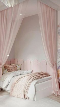 a bed with pink curtains and pillows in a room that has white carpet on the floor