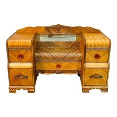 an antique wooden desk with two drawers on one side and a mirror on the other