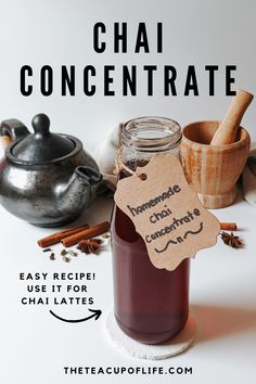 a jar of homemade chai concentrate sitting on top of a table with cinnamons