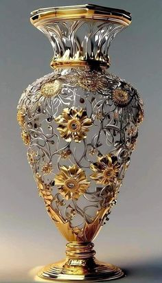 an ornate gold and silver vase with flowers on the bottom is shown against a gray background