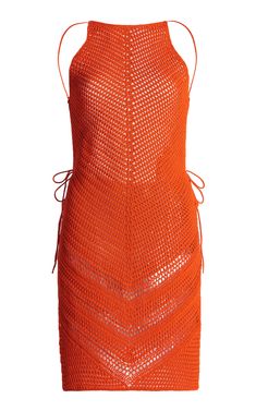 an orange knitted dress with straps on the front and back, in mesh fabric