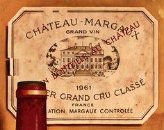 a bottle of chateau margraau grand vin chargaat next to a sign on the wall