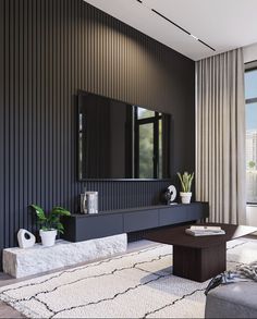 a living room with black walls and white rugs on the floor, along with a large window