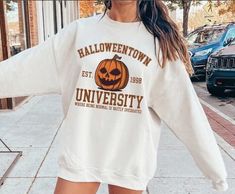 Halloweentown University Sweatshirt, Halloween Town Est 1998 Sweatshirt, Fall Sweatshirt, Pumpkin Shirt, Womens Halloween Sweatshirt, Retro - We use Bella Canvas, Gildan and Circle Clothing brands. If there is a specific one you would like to get please make a request by adding a note to seller at checkout page, subject to pricing and availability. If none is specified we will send the available brand. Color matching is guaranteed across different styles of shirts. Cheap University Logo Sweatshirt For Fall, Affordable University Logo Sweatshirt For Fall, Affordable Fall Sweatshirt With University Logo, Halloweentown University, Halloween Film, University Sweatshirts, Halloween Vintage, Sweatshirt Halloween, Estilo Hip Hop