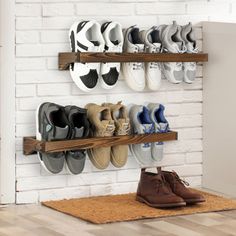 there are many pairs of shoes hanging on the wall