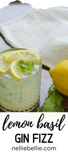 a lemon basil gin fizz is garnished with mint