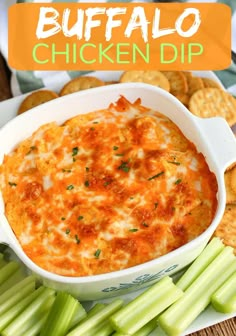 buffalo chicken dip with crackers and celery on the side in a white dish