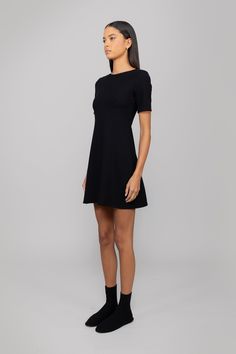 Crafted in our comfortably secure stretch ponte, The Rio Short Sleeve Mini Dress features a flattering, soft straight neckline, a slight flare, and the perfect mid-thigh length. Fit And Flare A-line Mini Dress In Elastane, Flattering Elastane Bodycon Dress, Modern Fitted A-line Mini Dress, A-line Mini Dress With Flattering Silhouette In Elastane, Fit And Flare Mini Dress In Elastane, Black Fit And Flare Elastane Dress, Classic Midi Length Elastane Dresses, Sleek Elastane Dress With Straight Neckline, Elastane A-line Mini Dress With Fit And Flare