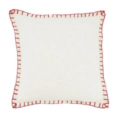 a white pillow with red trim