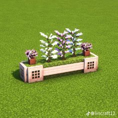 a bench with flowers growing out of it in the middle of an open field,