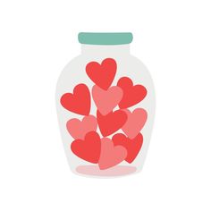 a jar filled with hearts sitting on top of a table