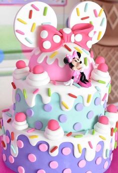 a minnie mouse cake with sprinkles on it