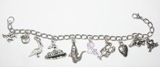 "This Louisiana State charm bracelet is handcrafted using Rhodium Finished Nickel Free Cable Chain, 10 nickle free zinc alloy charms, Duck Charm, Tomato Charm, Pelican Charm, Louisiana State Charm, Steamboat Charm, Alligator Charm, I Love Jazz Charm, Lobster Charm, Strawberry Charm, Wild Boar Charm, Lobster Clasp This bracelet measures approx 7 - 1/2 \" in length. You have the option to choose other bracelets sizes and also to add an initial charm When purchasing a bracelet for someone other tha Nickel Free Novelty Bracelet Jewelry, Silver Novelty Jewelry With Lobster Clasp, Novelty Charms Bracelet Jewelry, Novelty Jewelry Charms Bracelet, Metal Dangle Charm Bracelet For Gifts, Novelty Silver Hypoallergenic Bracelets, Metal Chain Bracelet With Charms For Gift, Metal Chain Bracelet With Charms As Gift, Hypoallergenic Metal Bracelets For Jewelry Making