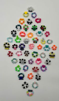 💟These Kandi rings are the perfect item to give to others at raves and trade with. Everyone will LOVE your gift when you suprise them with these cute rings, I promise.   🌈You will get randomly made Kandi rings made by me with lots of PLUR. ❤️Everything pictured are examples of some of the rings I have, and then there's many more available to be made!  *Every ring will have a charm bead in the middle! (Majority of the rings are made with my own custom 3d printed beads.)  *I use elastic string s Kandi Ring Ideas, Pony Bead Rings, Rave Trinkets, Rave Gift Ideas, Diy Things To Make And Sell, Kandi Ring, Kandi Charms, Kandi Perler, Kandi Beads