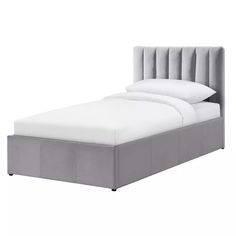 a bed with a gray headboard and foot board on it's side, in front of a white background