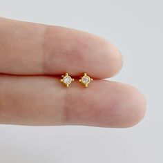 Listing is a Pair (2 Earrings) New Boho CZ with tiny gold ball earrings Features: Material: 92.5 Sterling Silver, 14k Gold plated Sterling Silver, 14k Rosegold plated Sterling Silver Head Jewel width: 4mm Stone Size: 2mm * Earring post: 22g / 0.7mm Regular butterfly backs Ready for a Gift 🎁 *All EARRINGS AND PIERCINGS ARE NOT REFUNDABLE OR EXCHANGEABLE DUE TO HYGIENE AND FOR YOUR SAFETY* Tiny Earrings, Cz Stud Earrings, Minimalist Earrings, Gold Plated Jewelry, Gold Plated Sterling Silver, Pure Silver, Jewelry Plate, Post Earrings, Sterling Silver Earrings