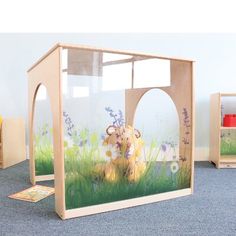 an animal themed display case in a children's playroom