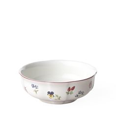 a white bowl with colorful flowers on it