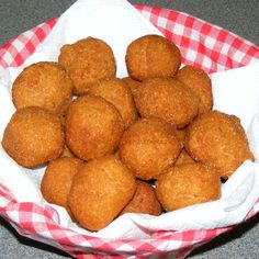 a basket filled with fried food on top of a table