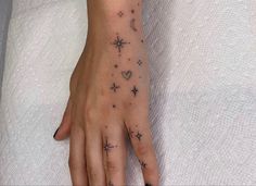 a woman's hand with stars on it