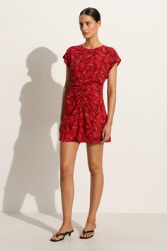 The Celestina Mini Dress in Selcetta Paisley Red features a high neckline, short cap sleeves and a relaxed skirt that softly falls down to a mini length. The waist is delicately gathered at the front and offers slender back ties to cinch as desired. Made from our signature rayon crepe and patterned with a red paisley motif throughout. Paisley Motif, Red Paisley, Maxi Dress Sale, Faithfull The Brand, Swim Accessories, New Print, High Neckline, Playsuit Jumpsuit, A Line Skirts