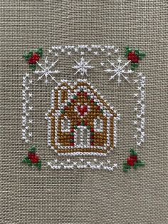 a close up of a cross stitch design