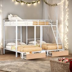 bunk beds with drawers underneath them in a room filled with christmas lights and garlands